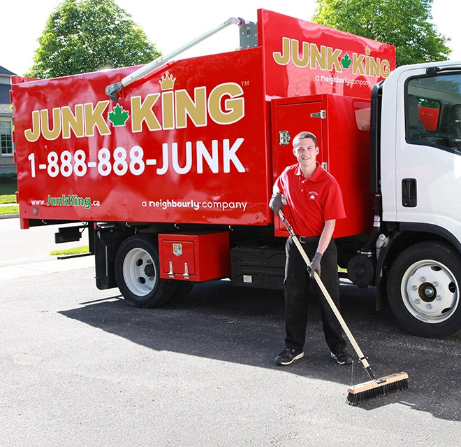 JUK employee standing beside the van.