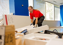 JUK Employee cleaning a room.