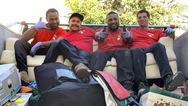 JUK employees posing together in a frame.