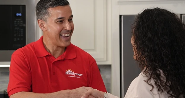 MRH employee shaking hands with a customer.