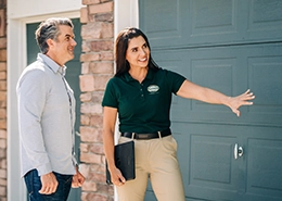 PDS worker explaining to client about a large door.