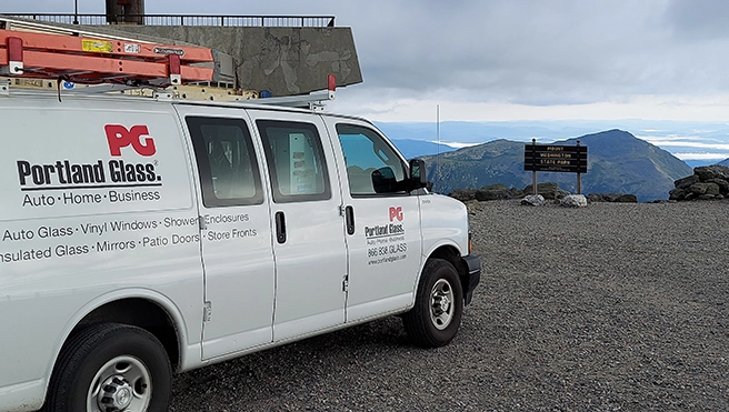 A Portland Glass van parked at mountain.