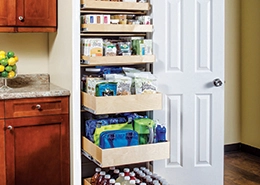 Pantry shelves with neatly organized items.