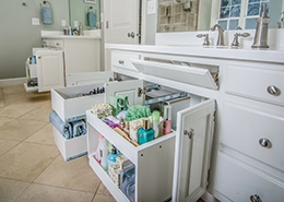 Bathroom shelves with neatly arranged toiletries.