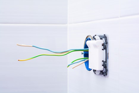 Exposed electrical wiring and a partially installed electrical box.