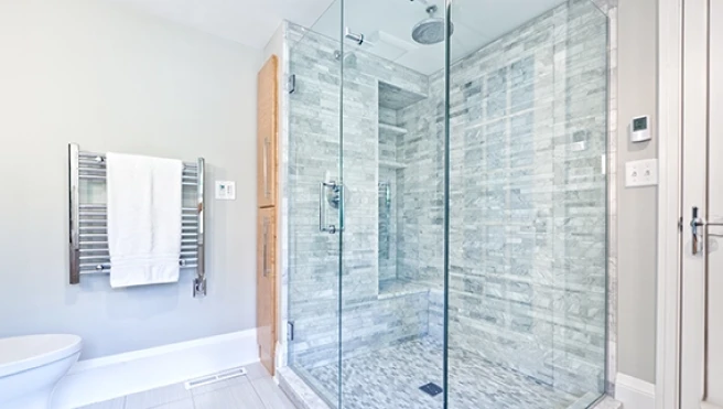 Modern bathroom with a large glass-enclosed shower area.