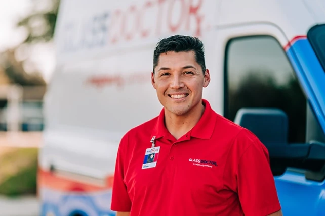 Technician standing near a van.