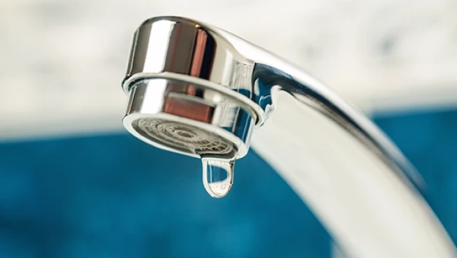 Water drop from faucet.