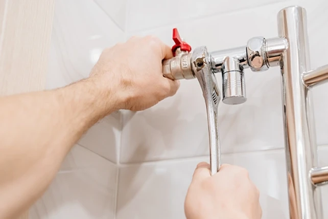 MRR Technician fixing pipes.
