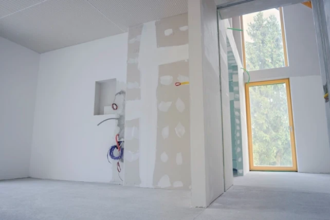 Drywall surface with a visible patch repair.