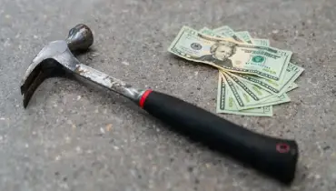 hammer and five twenty dollar bills.