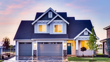 two story home light blue three car garage