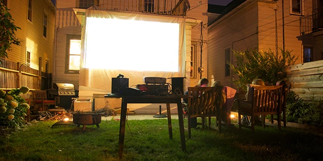 Nighttime outdoor movie party.