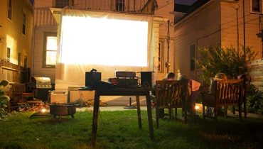 Nighttime outdoor movie party.