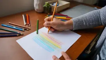 Person writing on paper