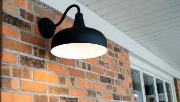 Black lamp on the exterior of a home.