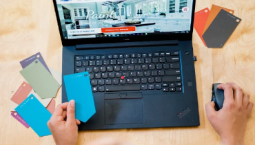 Person looking at paint samples on a laptop screen.