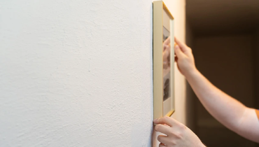 Hanging a picture on a plaster wall