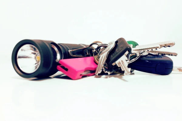 Keychain gadgets including flashlight and keys.