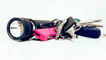 Keychain gadgets including flashlight and keys.
