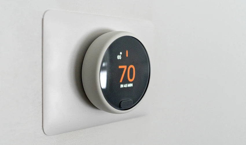 digital thermostat showing 70 degrees
