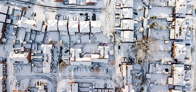 overhead view of snow covered neighborhood