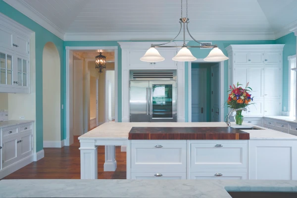 modern kitchen with teal colored walls