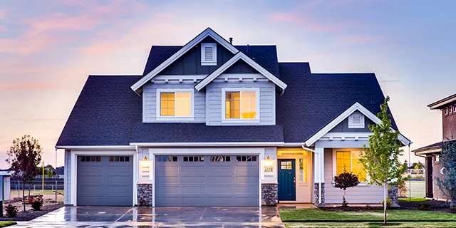 two story home light blue three car garage