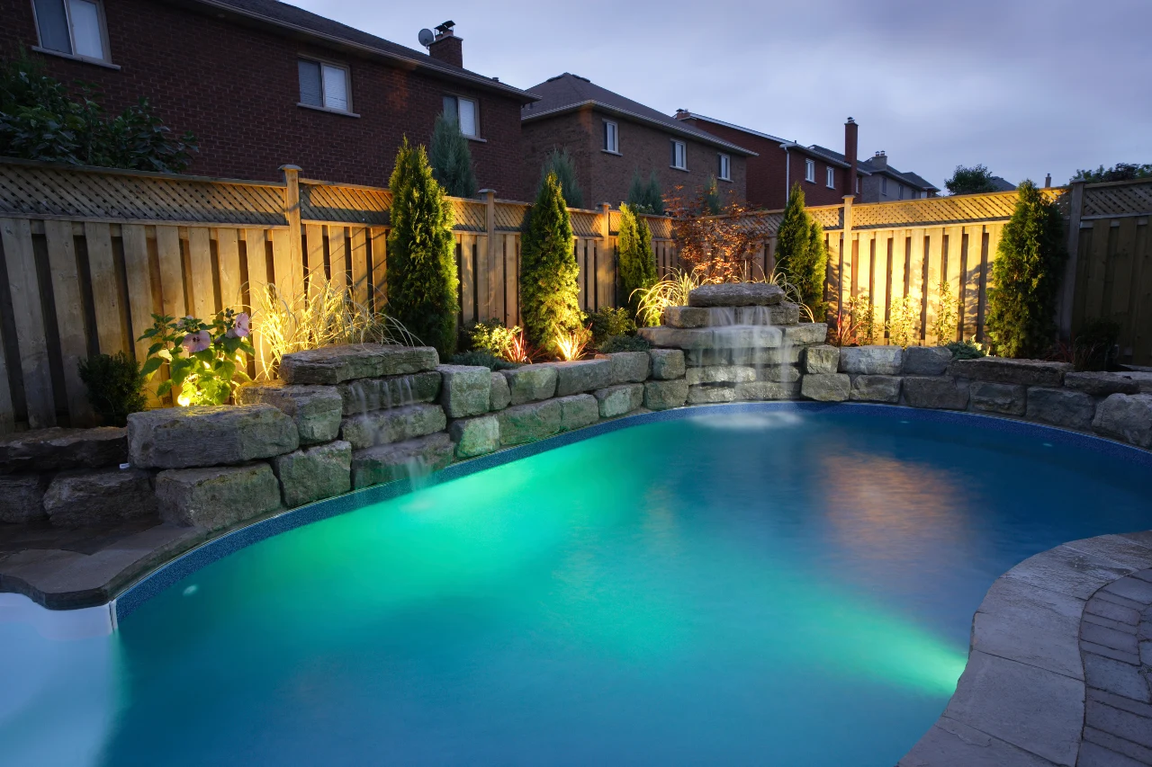 luxurious backyard pool at dusk