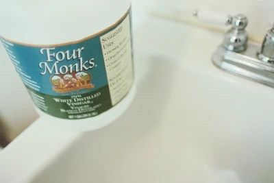 Four Monks vinegar on clean bathroom sink