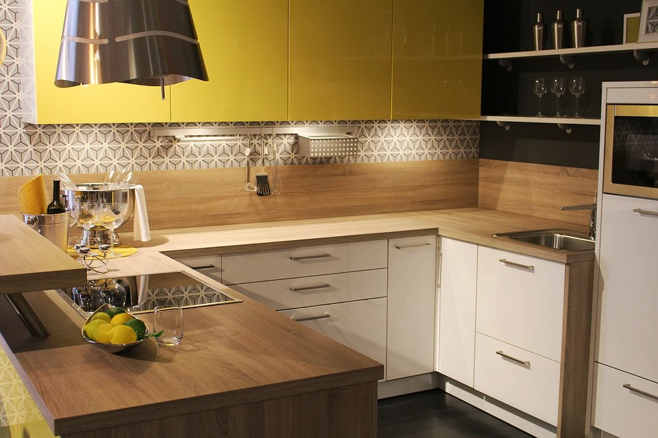 modern yellow and white kitchen with under-cabinet lighting