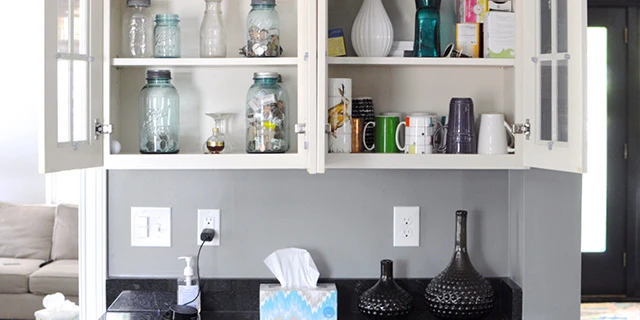 Kitchen cupboard filled with glassware