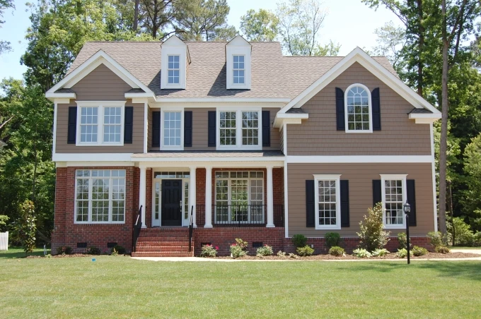 three story hardiboard and brick home