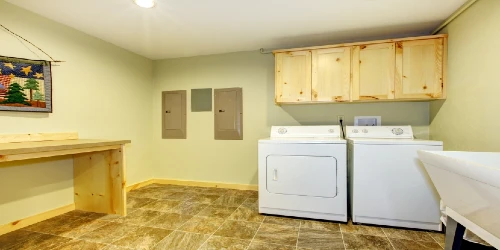 laundry room with yellow walls
