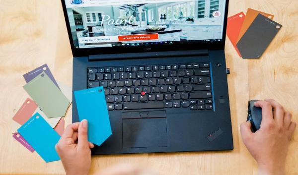 Person looking at paint samples on a laptop screen