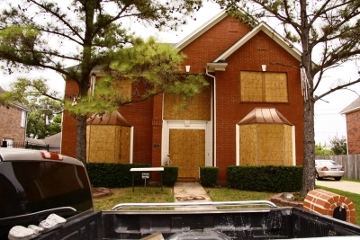 house with boarded up windows