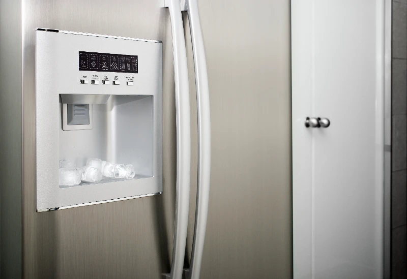 Water maker on the front of a stainless steel refrigerator