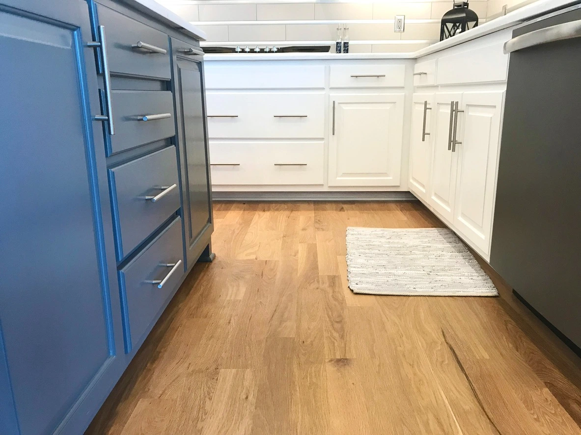 Two tone kitchen cabinets in navy and classic white.