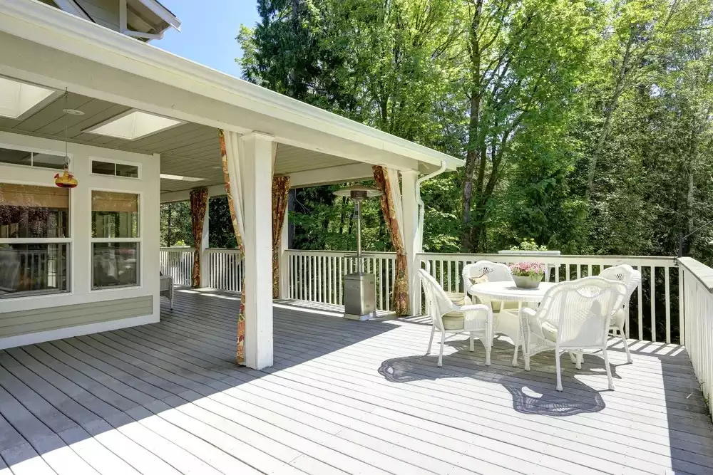 Newly renovated outdoor deck with chair and table setting