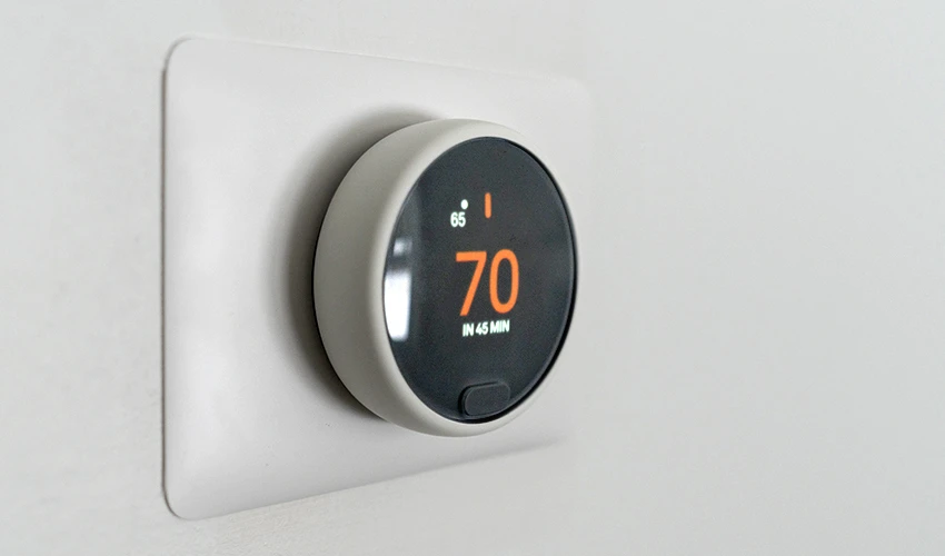 Digital thermostat showing 70 degrees.