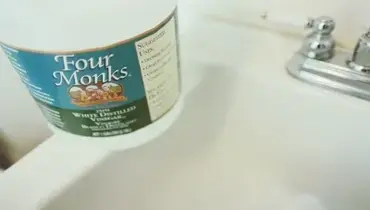 Four Monks vinegar on clean bathroom sink