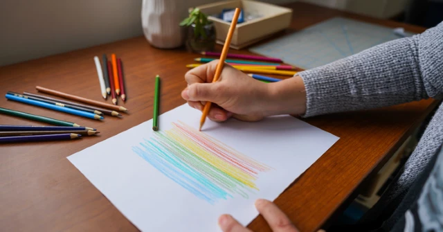 person writing on paper