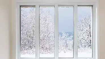 4 long windows with winter scene outside.