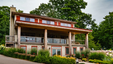 Home with wood siding and red shutters.
