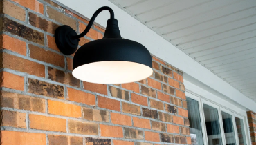 Black lamp on the exterior of a home.