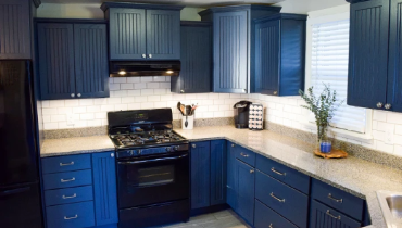Modern kitchen with blue cabinets.