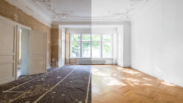 Ladder against top floor of Spanish style home.